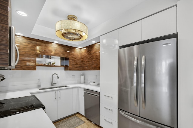 336 Golfview Rd Unit 1006, North Palm Beach, FL 33408 - kitchen with stainless steel appliances, white cabinetry, light countertops, recessed lighting, and modern cabinets