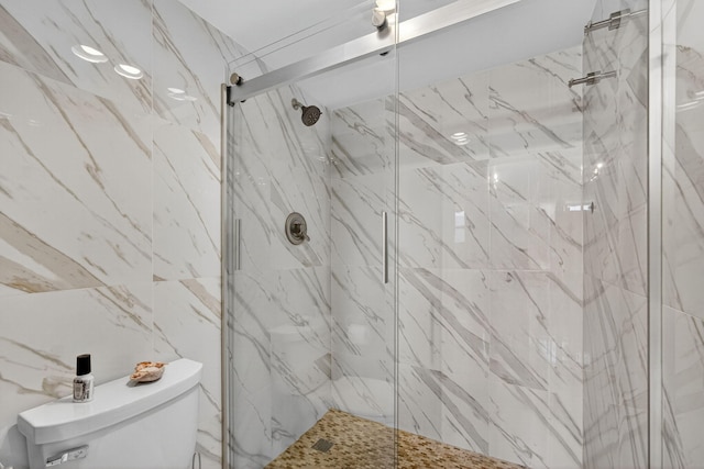 336 Golfview Rd Unit 1006, North Palm Beach, FL 33408 - bathroom featuring toilet and a marble finish shower