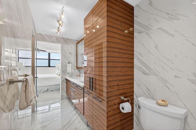 336 Golfview Rd Unit 1006, North Palm Beach, FL 33408 - full bath with tile walls, marble tiled flooring, vanity, and a stall shower