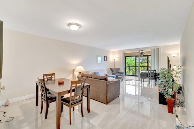 14723 Cumberland Dr Unit 404B, Delray Beach, FL 33446 - dining space featuring ceiling fan and light tile patterned floors