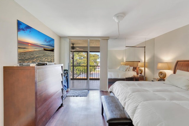 14723 Cumberland Dr Unit 404B, Delray Beach, FL 33446 - bedroom with access to outside, wood finished floors, and expansive windows