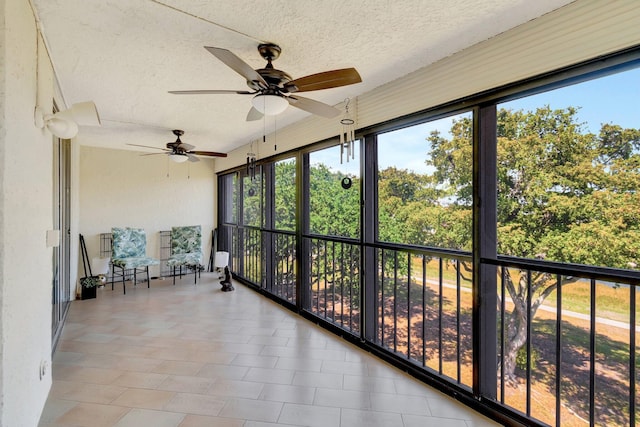 14723 Cumberland Dr Unit 404B, Delray Beach, FL 33446 - unfurnished sunroom featuring a textured ceiling, a ceiling fan, and plenty of natural light