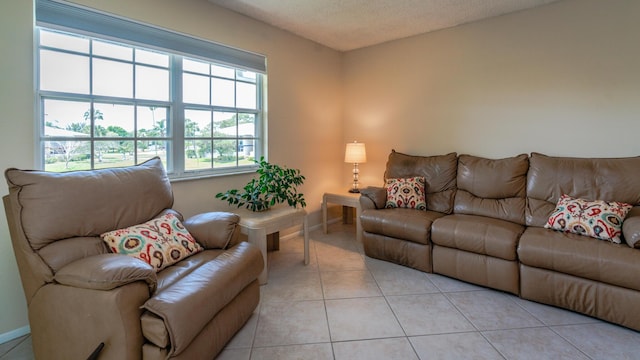 1563 SE Royal Green Cir Unit B-204, Port Saint Lucie, FL 34952 - living room with light tile patterned floors and a textured ceiling