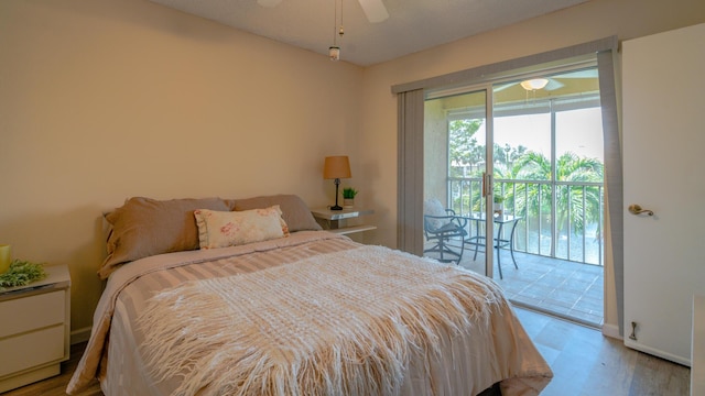 1563 SE Royal Green Cir Unit B-204, Port Saint Lucie, FL 34952 - bedroom featuring access to exterior, wood finished floors, and ceiling fan