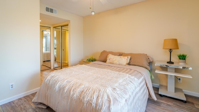 1563 SE Royal Green Cir Unit B-204, Port Saint Lucie, FL 34952 - bedroom featuring wood finished floors and a closet