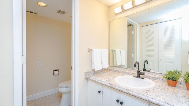 1563 SE Royal Green Cir Unit B-204, Port Saint Lucie, FL 34952 - bathroom featuring vanity, tile patterned floors, and a closet