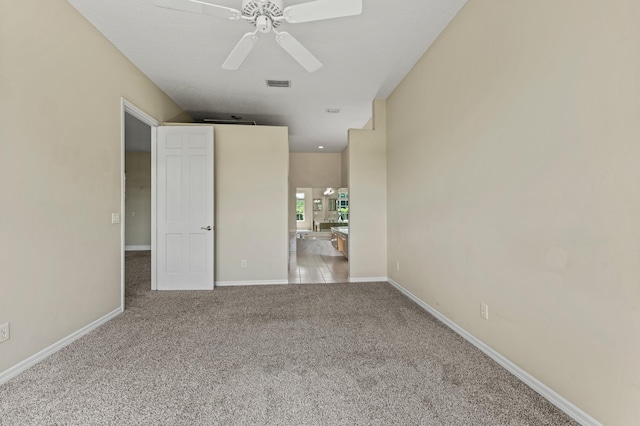 407 SW Fairway Lndg, Port Saint Lucie, FL 34986 - unfurnished bedroom with carpet floors, connected bathroom, and ceiling fan