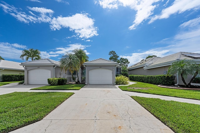 407 SW Fairway Lndg, Port Saint Lucie, FL 34986 - view of front of home featuring a garage, stucco siding, a front yard, and concrete driveway