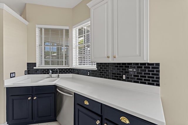 407 SW Fairway Lndg, Port Saint Lucie, FL 34986 - kitchen featuring dishwasher, tasteful backsplash, white cabinetry, light countertops, and blue cabinetry