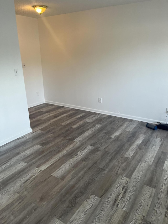 4316 Forest Rd, West Palm Beach, FL 33406 - unfurnished room with dark wood-style floors and baseboards