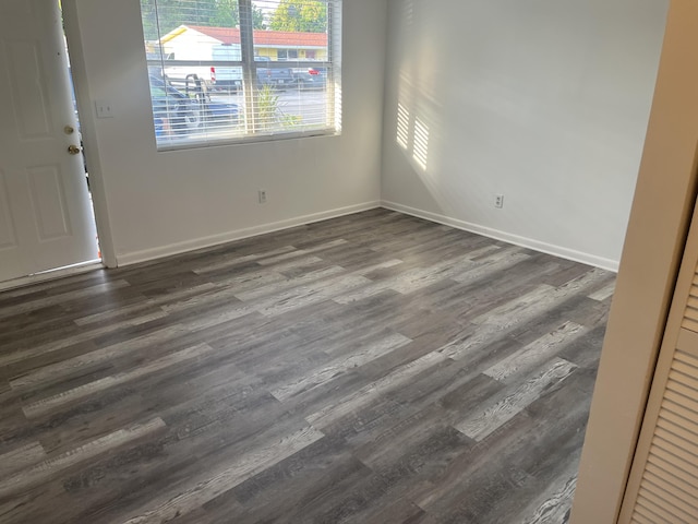 4316 Forest Rd, West Palm Beach, FL 33406 - spare room with dark wood-style flooring and baseboards