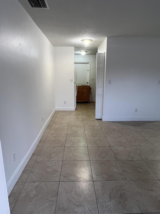4316 Forest Rd, West Palm Beach, FL 33406 - empty room with baseboards and a textured ceiling