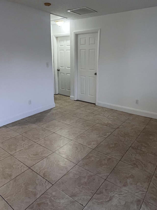 4316 Forest Rd, West Palm Beach, FL 33406 - spare room featuring baseboards and light tile patterned floors