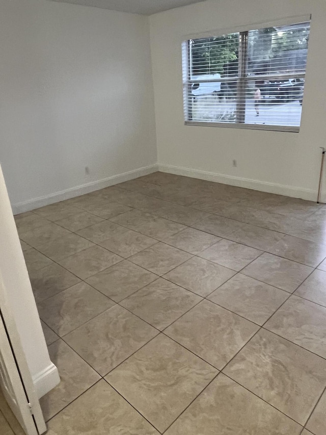 4316 Forest Rd, West Palm Beach, FL 33406 - unfurnished room with baseboards and light tile patterned floors