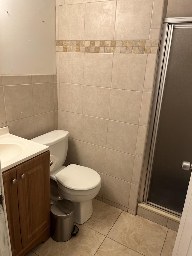 4316 Forest Rd, West Palm Beach, FL 33406 - bathroom with tile walls, a stall shower, vanity, and tile patterned floors
