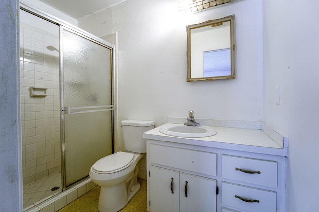 bathroom featuring a shower stall and vanity