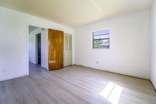 empty room featuring wood finished floors