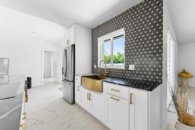 112 Parkwood Dr, Royal Palm Beach, FL 33411 - kitchen with stainless steel fridge with ice dispenser, light marble finish floors, dark stone countertops, and white cabinets