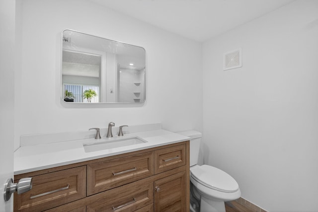 15036 Ashland Ln Unit 44, Delray Beach, FL 33484 - bathroom featuring vanity and toilet