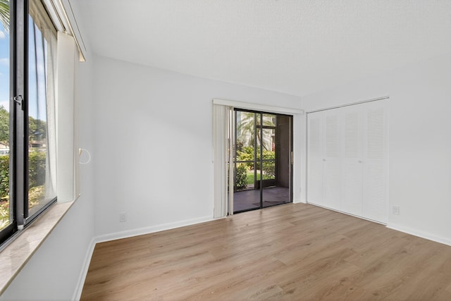 15036 Ashland Ln Unit 44, Delray Beach, FL 33484 - empty room with wood finished floors and baseboards