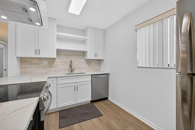 15036 Ashland Ln Unit 44, Delray Beach, FL 33484 - kitchen with stainless steel appliances, ventilation hood, light wood-type flooring, white cabinets, and open shelves