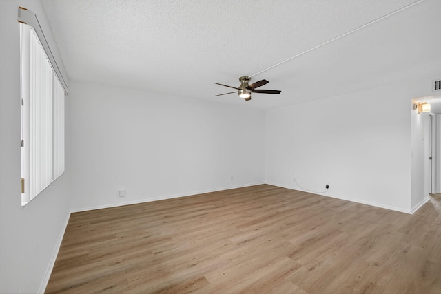 15036 Ashland Ln Unit 44, Delray Beach, FL 33484 - spare room featuring a ceiling fan, light wood-style flooring, and a textured ceiling