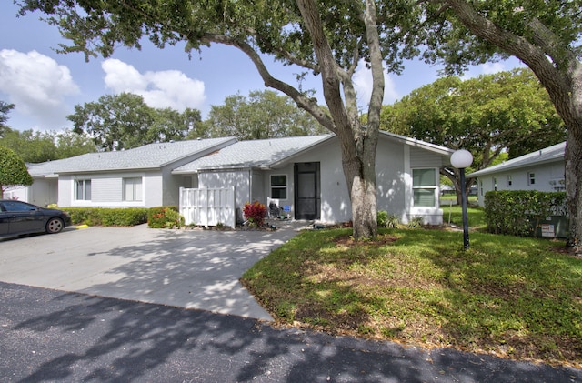 18541 Cherborg Dr Unit D, Boca Raton, FL 33496 - view of front of property featuring stucco siding and a front lawn