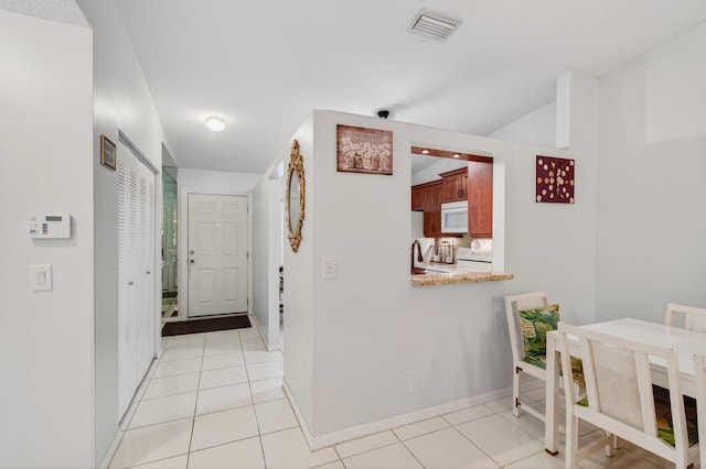 18541 Cherborg Dr Unit D, Boca Raton, FL 33496 - corridor featuring light tile patterned flooring