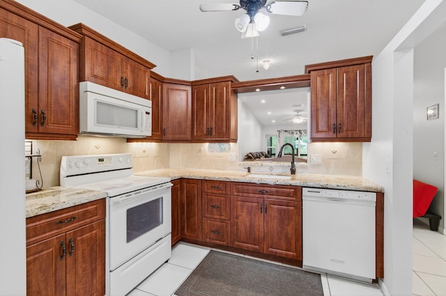 18541 Cherborg Dr Unit D, Boca Raton, FL 33496 - kitchen featuring white appliances, a ceiling fan, light tile patterned flooring, decorative backsplash, and light stone countertops