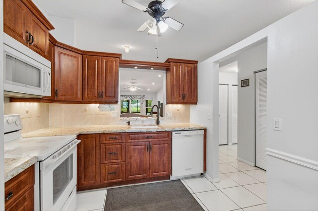 18541 Cherborg Dr Unit D, Boca Raton, FL 33496 - kitchen featuring white appliances, a ceiling fan, backsplash, light tile patterned floors, and light stone countertops