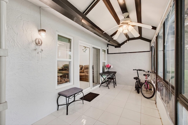 18541 Cherborg Dr Unit D, Boca Raton, FL 33496 - sunroom with a ceiling fan, a textured wall, and tile patterned floors