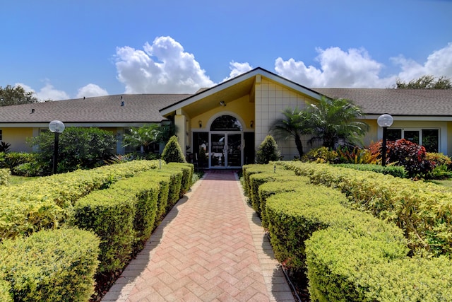 18541 Cherborg Dr Unit D, Boca Raton, FL 33496 - view of front facade with roof with shingles