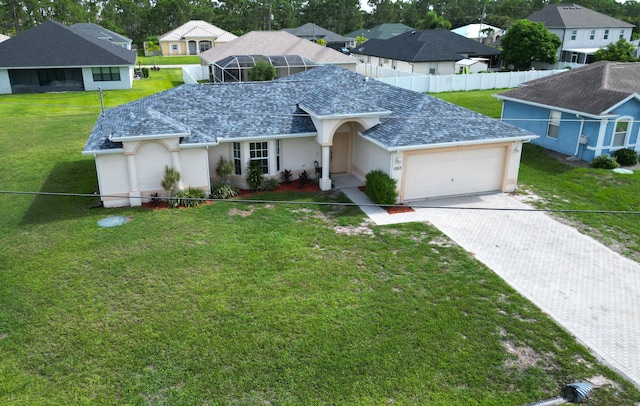 5705 NW Crocus Ave, Port Saint Lucie, FL 34986 - view of front of property with a garage, stucco siding, decorative driveway, a residential view, and roof with shingles