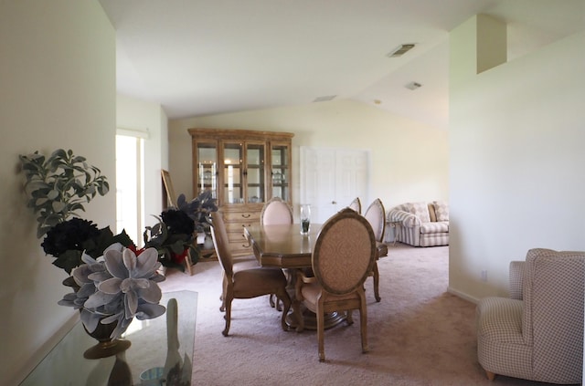 5705 NW Crocus Ave, Port Saint Lucie, FL 34986 - carpeted dining room featuring vaulted ceiling