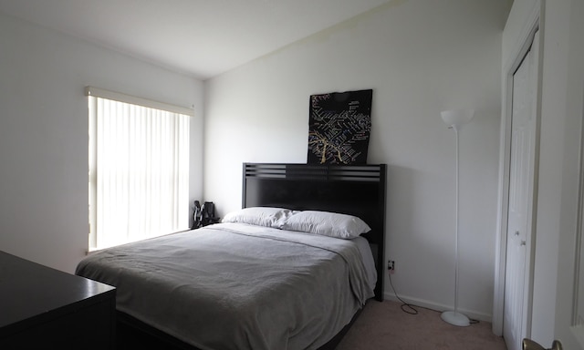 5705 NW Crocus Ave, Port Saint Lucie, FL 34986 - bedroom with light carpet and baseboards