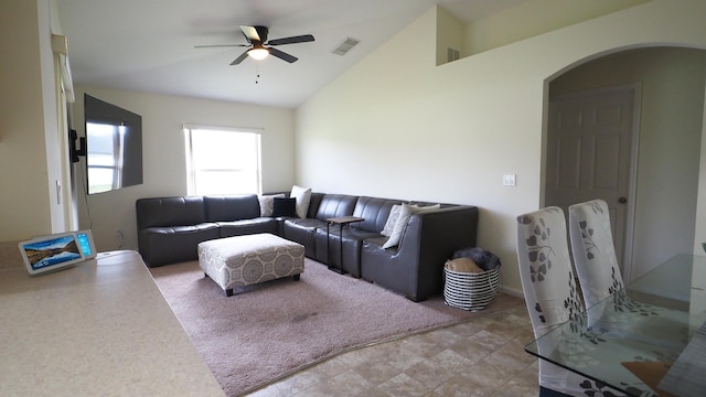 5705 NW Crocus Ave, Port Saint Lucie, FL 34986 - living area featuring arched walkways, ceiling fan, and vaulted ceiling
