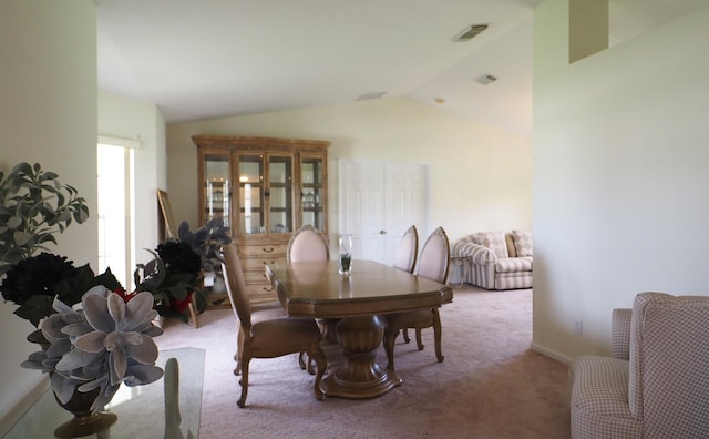 5705 NW Crocus Ave, Port Saint Lucie, FL 34986 - dining room featuring carpet and lofted ceiling
