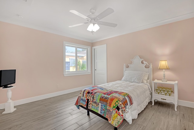 219 Claremont Ln, Palm Beach Shores, FL 33404 - bedroom with light wood-style flooring and a ceiling fan