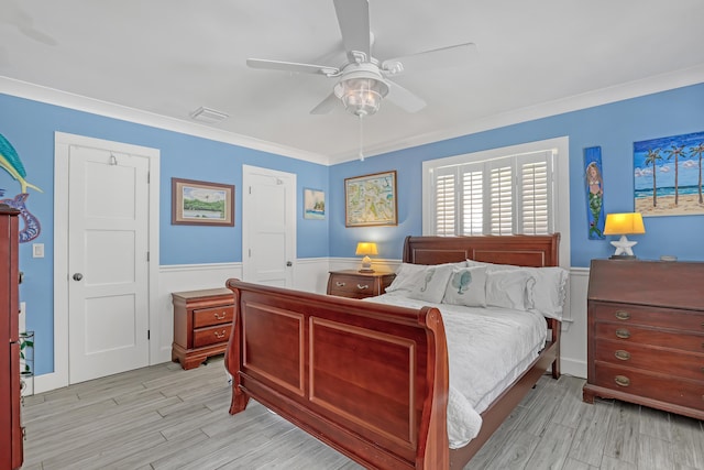 219 Claremont Ln, Palm Beach Shores, FL 33404 - bedroom featuring wainscoting, wood finished floors, ornamental molding, and ceiling fan