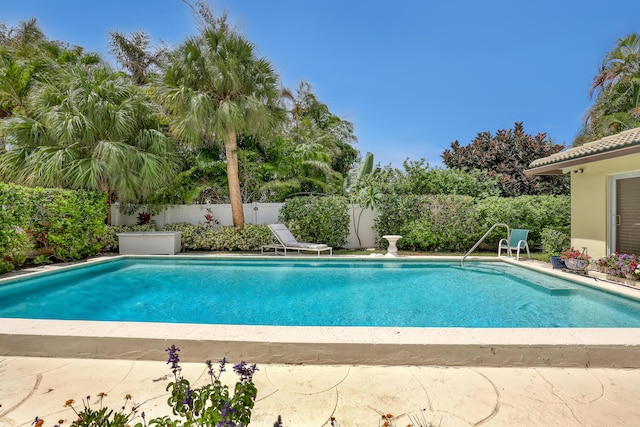 219 Claremont Ln, Palm Beach Shores, FL 33404 - view of swimming pool with a fenced backyard