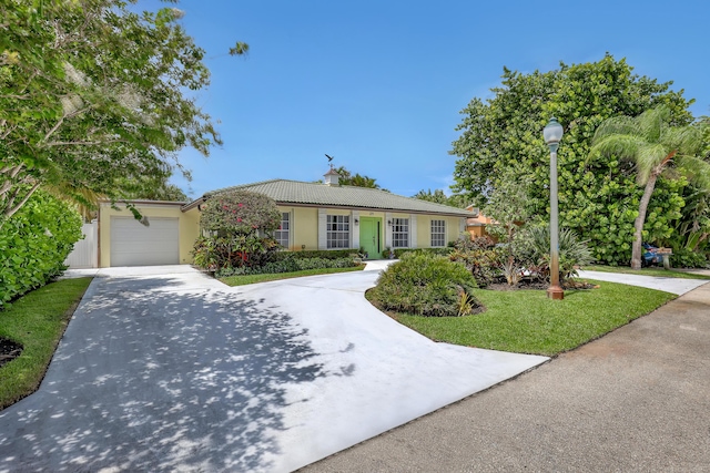 219 Claremont Ln, Palm Beach Shores, FL 33404 - ranch-style house featuring stucco siding, driveway, an attached garage, and a chimney