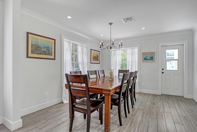 219 Claremont Ln, Palm Beach Shores, FL 33404 - dining area with a chandelier, light wood-type flooring, crown molding, and recessed lighting