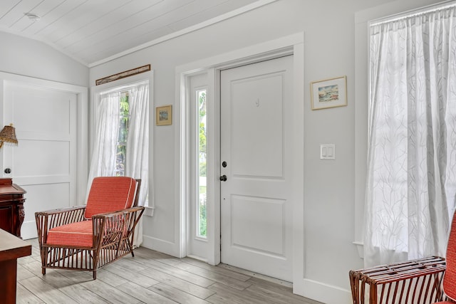 219 Claremont Ln, Palm Beach Shores, FL 33404 - foyer featuring vaulted ceiling and light wood-type flooring