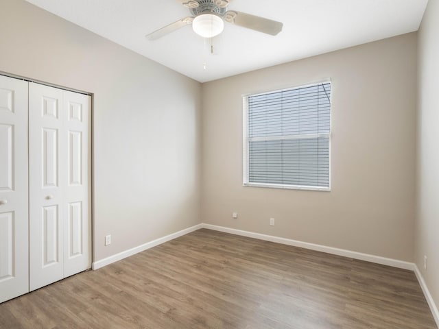 5412 NW 57th Way, Coral Springs, FL 33067 - unfurnished bedroom featuring wood finished floors, a closet, and a ceiling fan