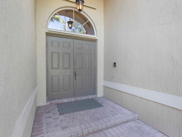 5412 NW 57th Way, Coral Springs, FL 33067 - view of exterior entry featuring stucco siding