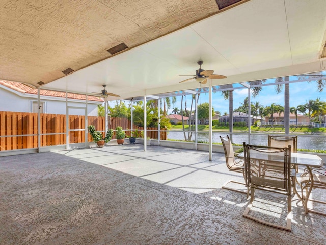 5412 NW 57th Way, Coral Springs, FL 33067 - unfurnished sunroom with ceiling fan and a water view