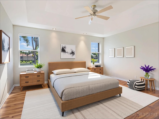 5412 NW 57th Way, Coral Springs, FL 33067 - bedroom with light wood-type flooring, a ceiling fan, recessed lighting, and a raised ceiling