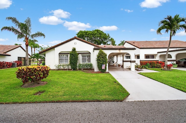 5707 Parkwalk Cir E, Boynton Beach, FL 33472 - view of front of home featuring concrete driveway, stucco siding, and a front yard