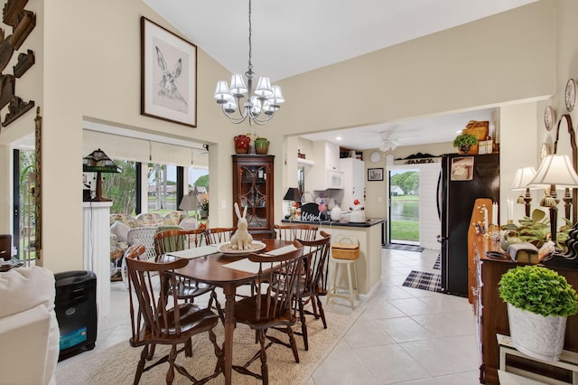 5707 Parkwalk Cir E, Boynton Beach, FL 33472 - dining room with high vaulted ceiling, plenty of natural light, light tile patterned floors, a chandelier, and ceiling fan