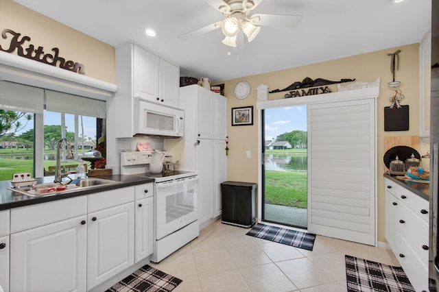 5707 Parkwalk Cir E, Boynton Beach, FL 33472 - kitchen with white appliances, dark countertops, white cabinets, ceiling fan, and recessed lighting